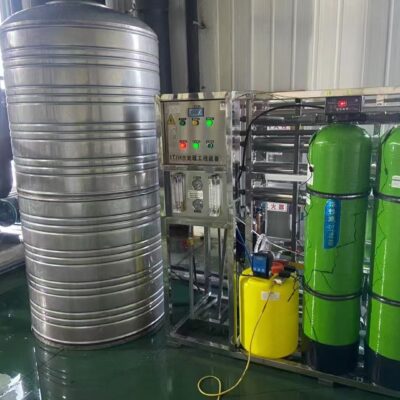 An efficient water treatment system featuring a stainless steel tank, control panel, and green filters.